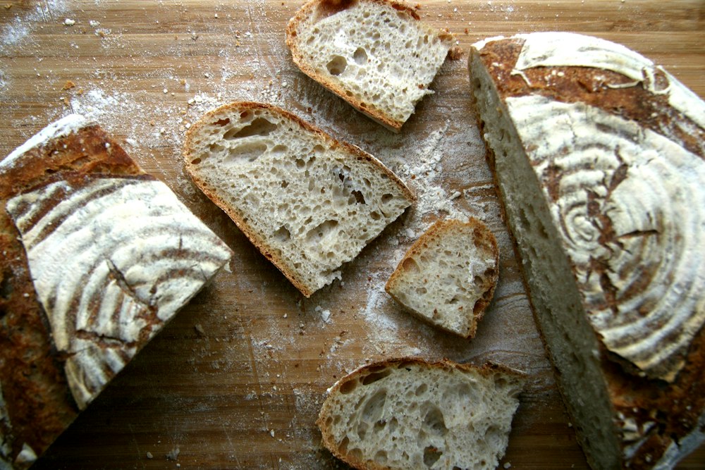 Assorted sliced artisan bread loaves on a table