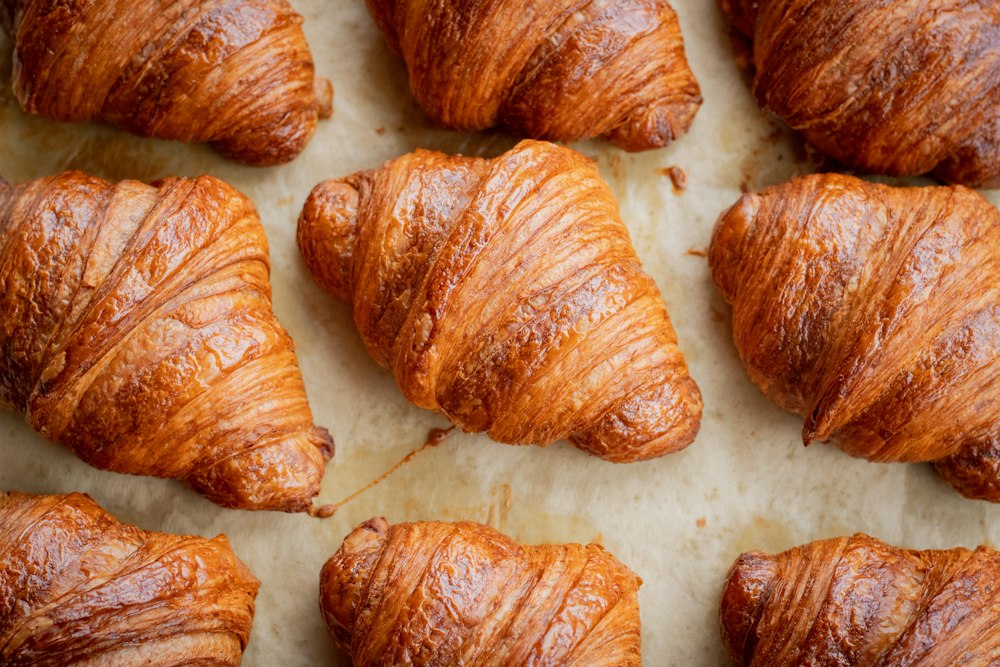 Freshly baked butter croissants on a table