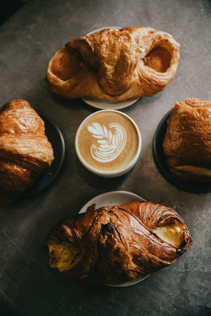 Baked breads around a cup of coffee